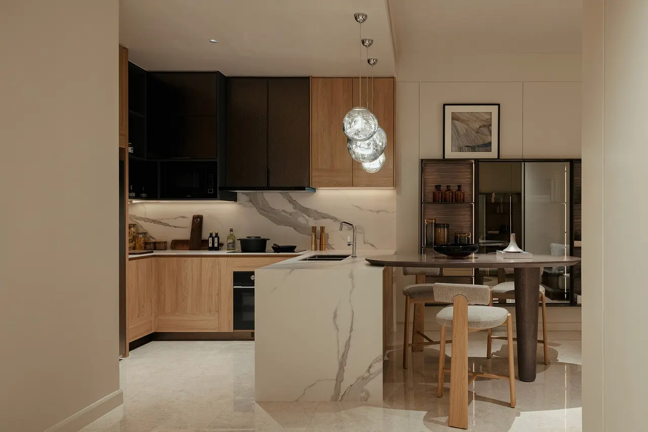 Kitchen with marble island, breakfast bar and timber cabinetry — show unit