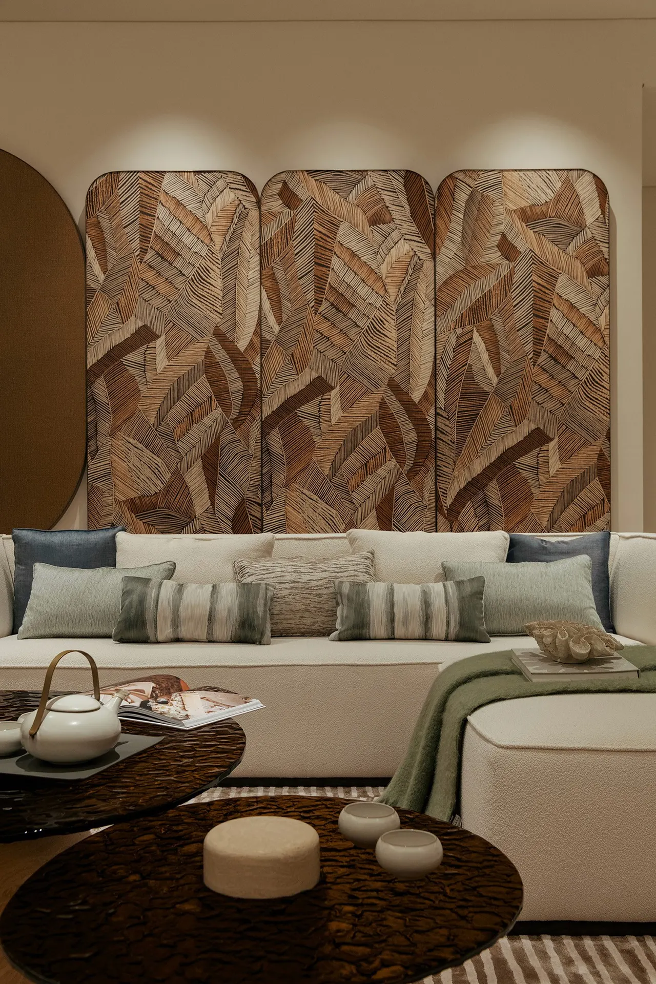 Lounge corner with carved timber panelling and boucle sofa — show unit